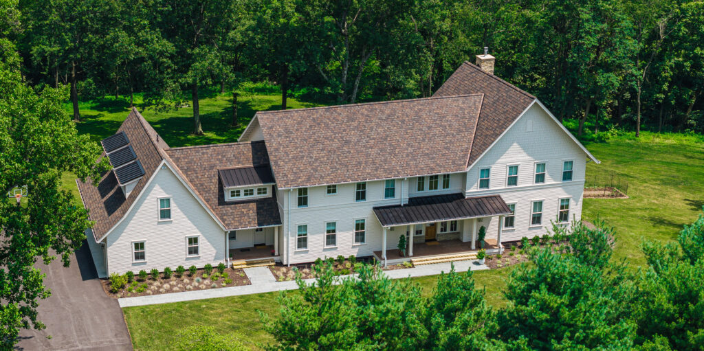A front view of a custom home built by Black Boot Builders.