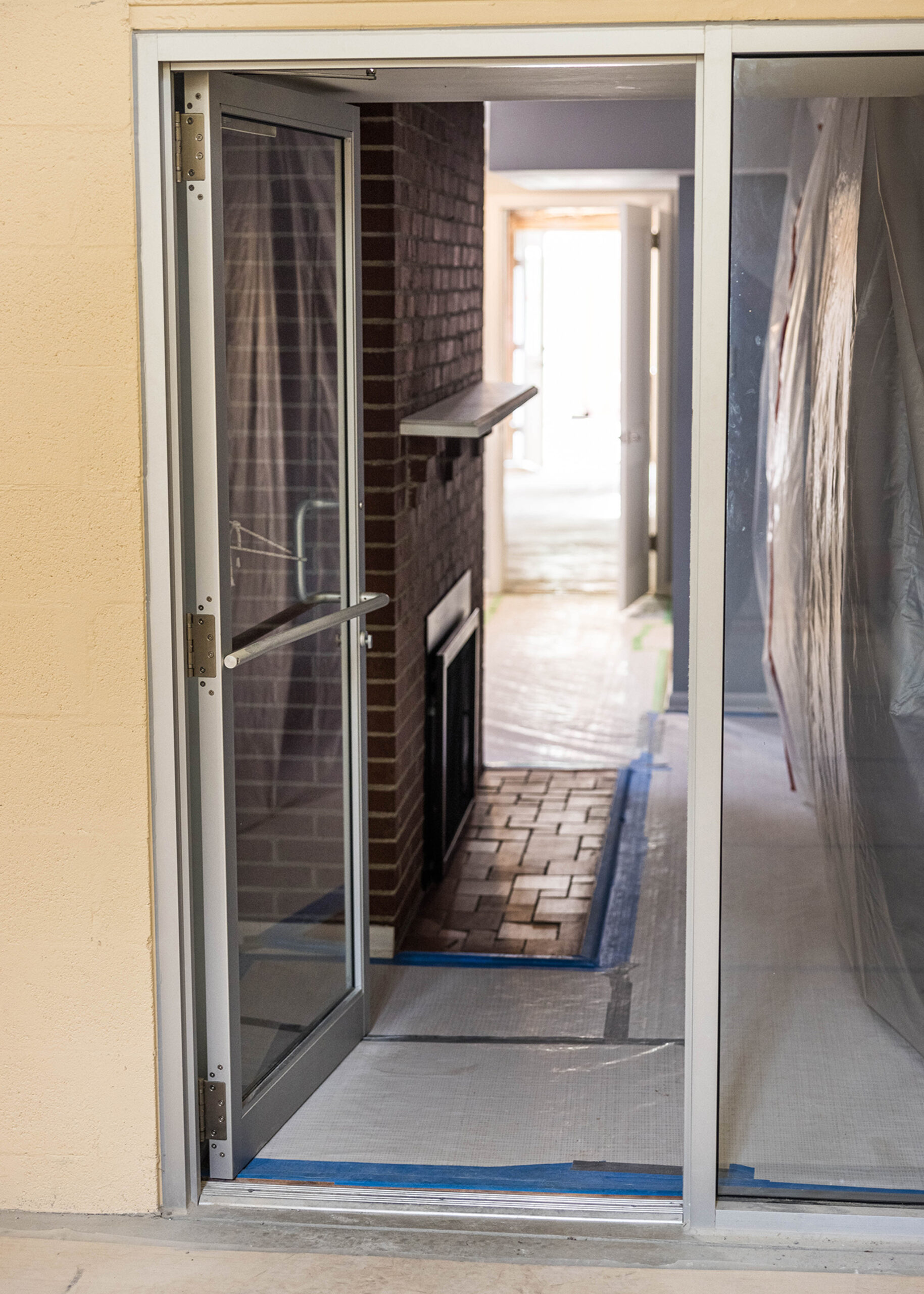 Entryway into covered room for site preparation of custom home design.