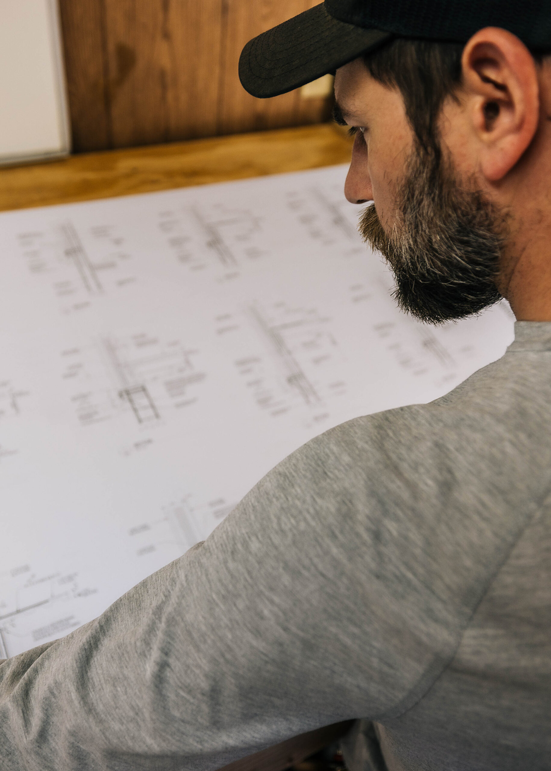 Project manager looking over floor plan for site preparation.